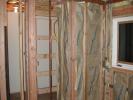 01/29 - They had extra insulation, so they did the coat closet and the bar wall
